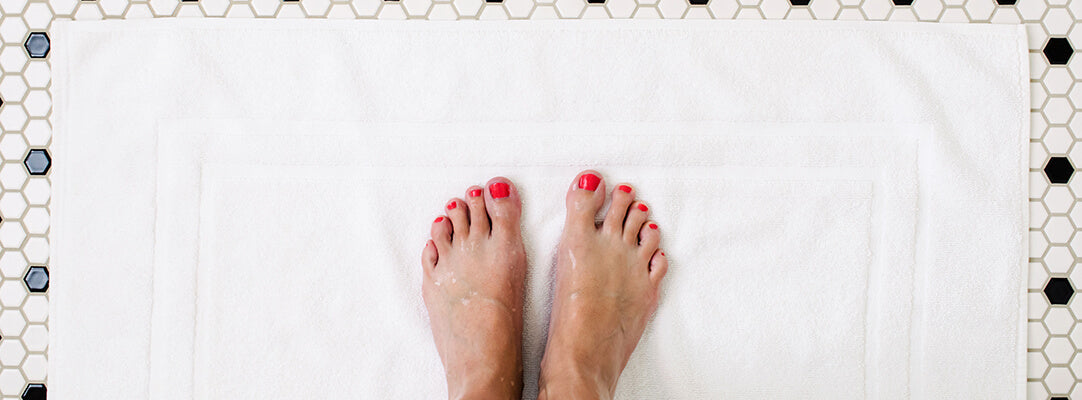 Premium cotton bath mats folded and stacked