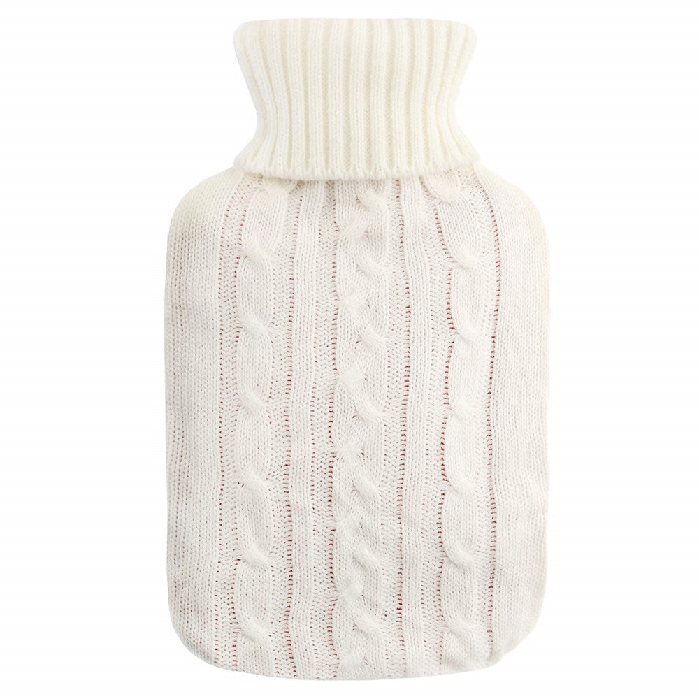 White hot water bottle with cable knit cover on a white background