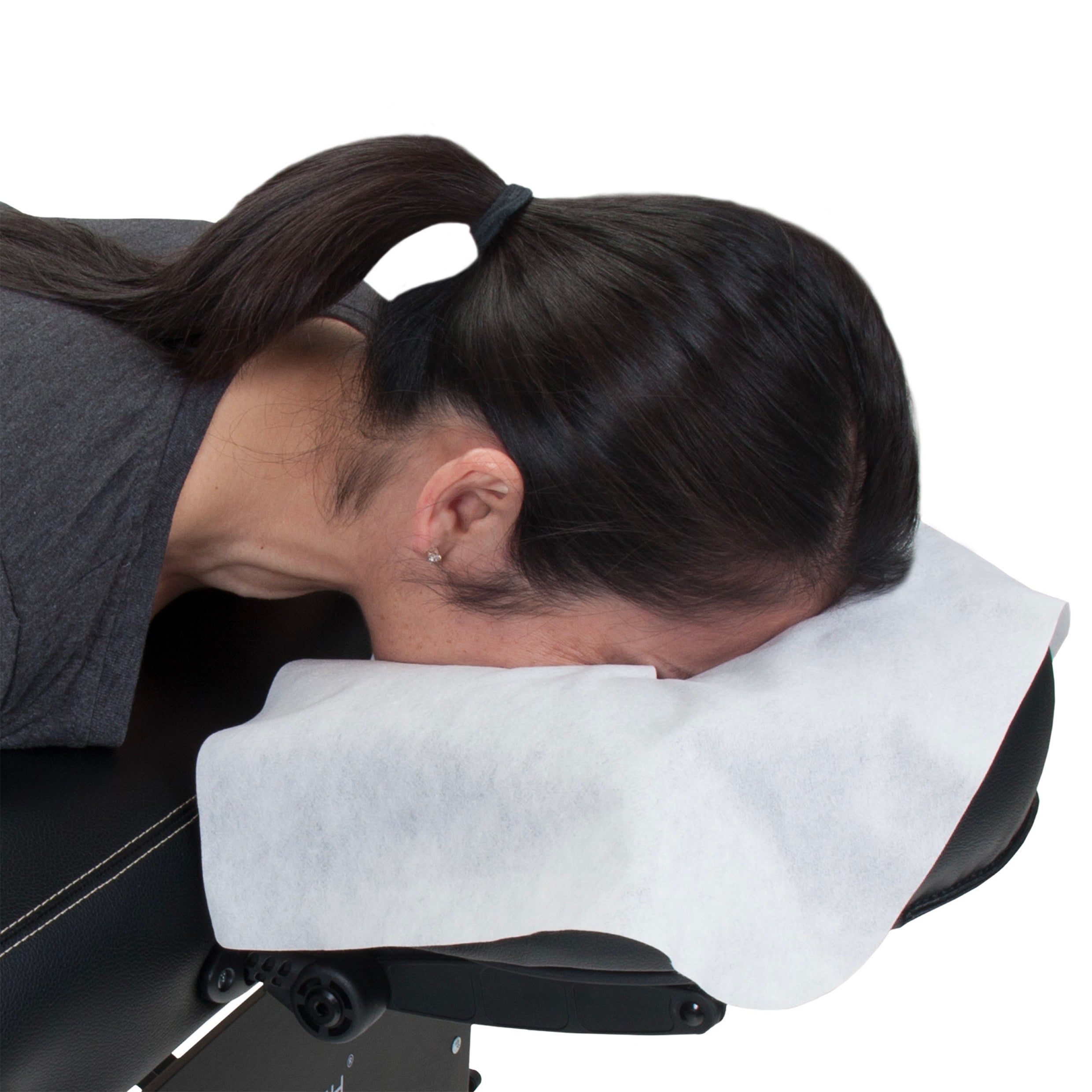 Female client using Earthlite flat diisposable head rest cover