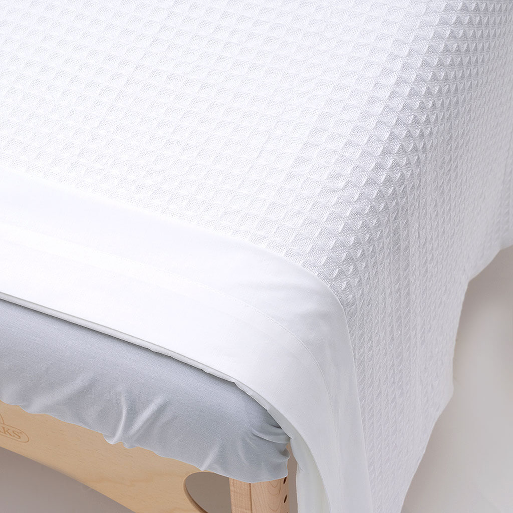 WR Linens BodyBest Waffle Weave Cotton  blanket on treatment table